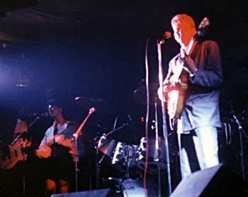 Bernie Hot Hot under the stage lights, Jim in the foreground